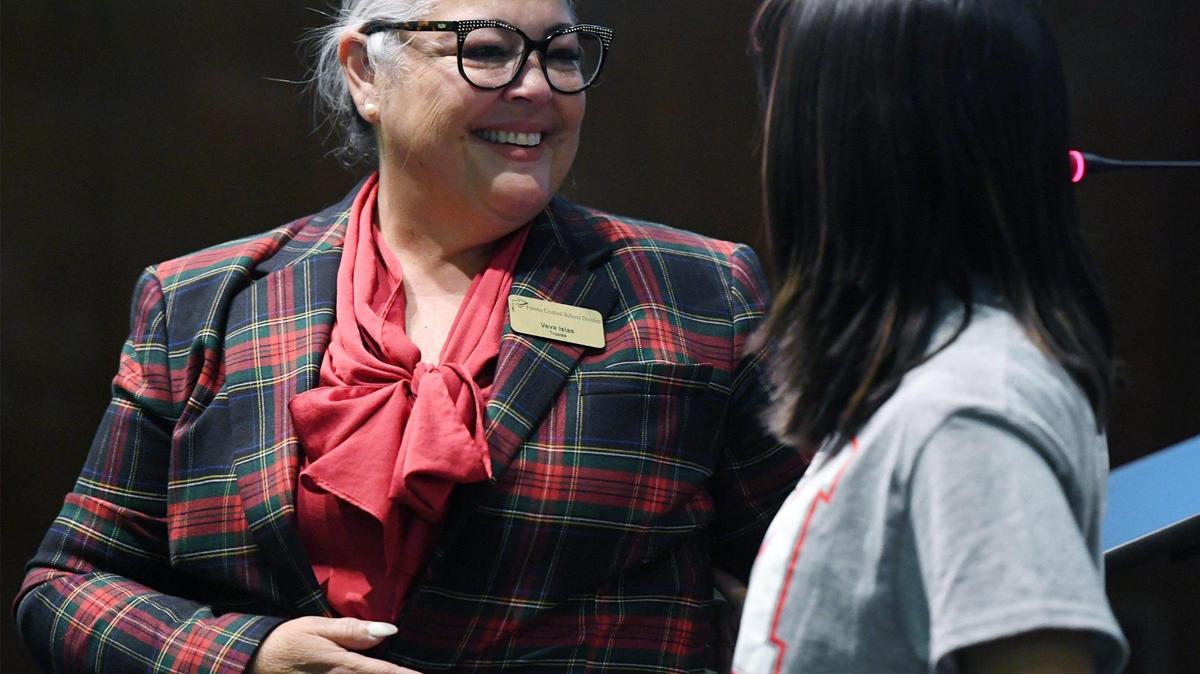 Newly elected FUSD school board trustee Veva Islas, left, with McLane student Aliyah Barajas, right, after being sworn in at a ceremony held Wednesday, Dec. 14, 2022 in Fresno.