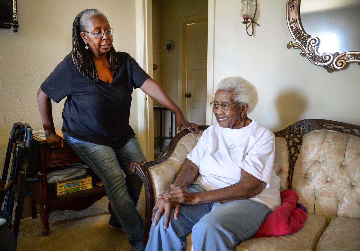 Aline Reed, left, reminisces about growing up with her mother Corine Burton Reed at her home in southwest Fresno on Tuesday, Oct. 23, 2018. Reed is turning 100 on Monday.