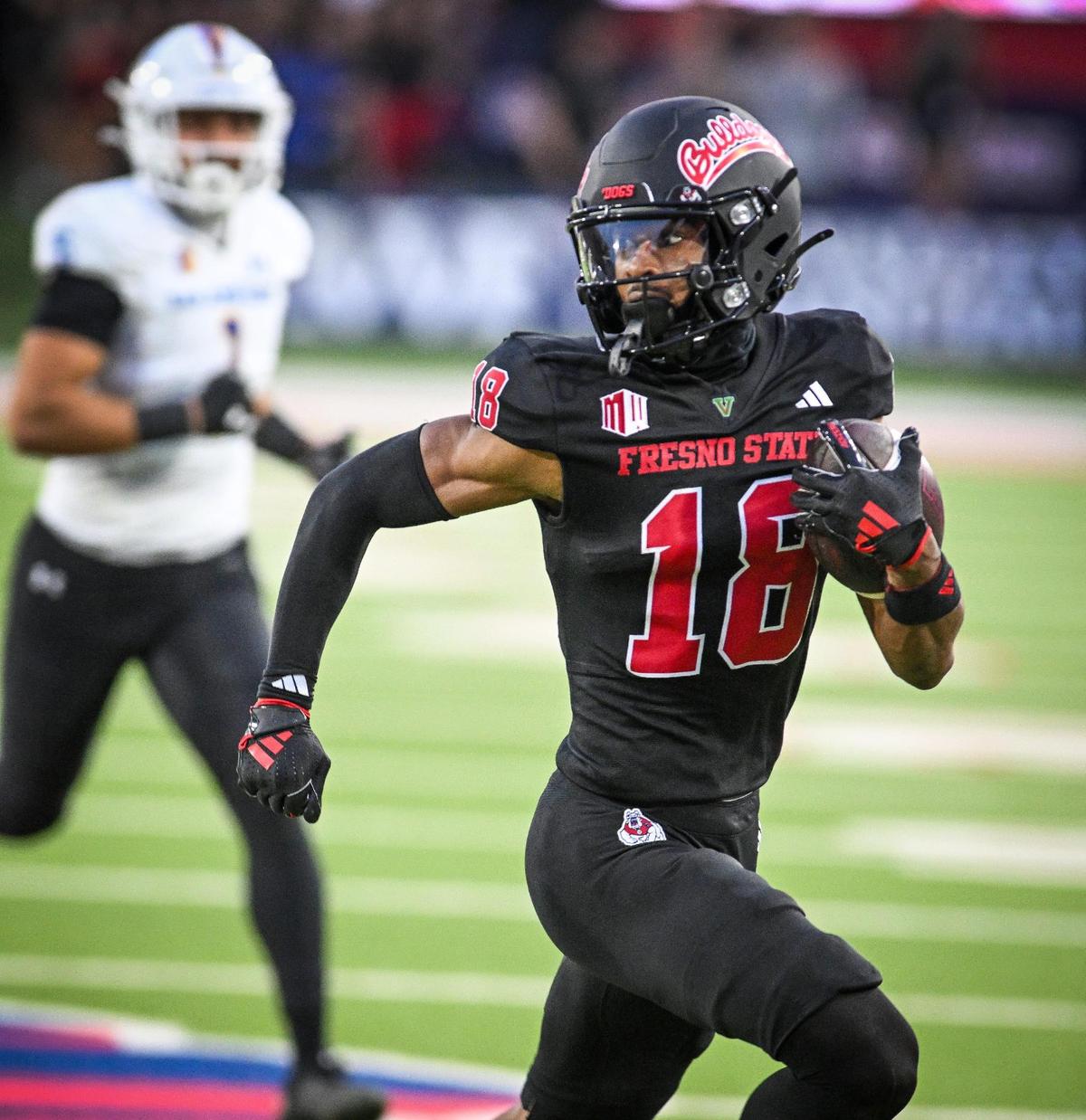 Fresno State’s Jalen Moss looks back before scoring a touchdown on a pass reception against San José State during their game at Valley Children’s Stadium in Fresno on Saturday, Oct. 26, 2024.