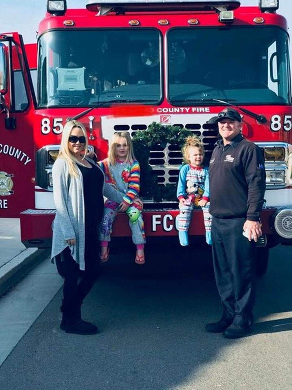 Amanda Sawyer, left, with husband Nick Reeder, right. Sawyer died earlier this month after giving birth to twin girls. Now the community is rallying around Reeder, who is a Fresno County firefighter, to help support him and his five children.
