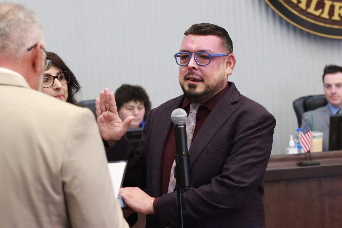 Veteran politician Eddie Valero (center) made history Tuesday morning at the Tulare County Board of Supervisors Chambers when he was sworn in to a second term to represent District 4.
