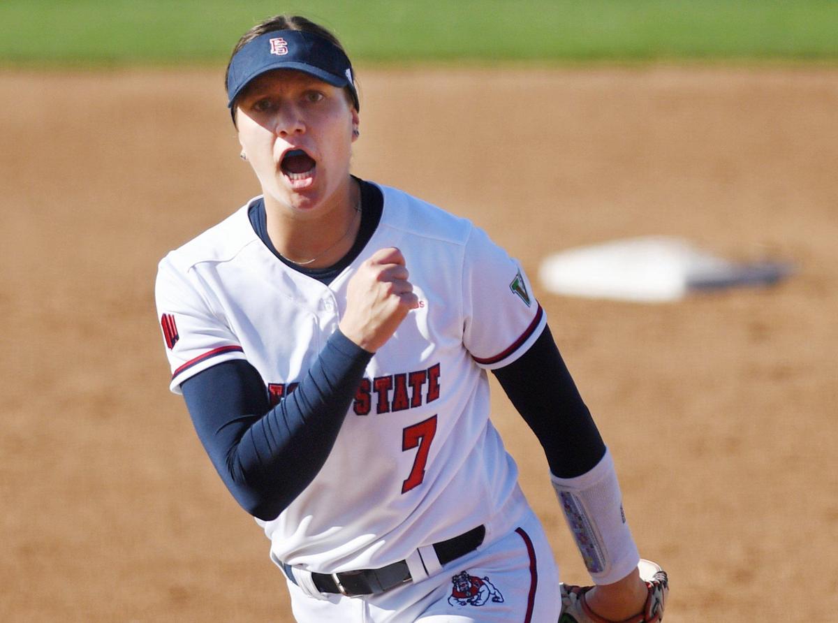 Fresno State pitcher Hailey Dolcini lets out a yell as she completes one of her 10 strikeouts against Pacific in Game 1 of a doubleheader Friday afternoon, Feb. 19, 2021, at Margie Wright Diamond in Fresno. The Bulldogs won 9-0 in five innings.