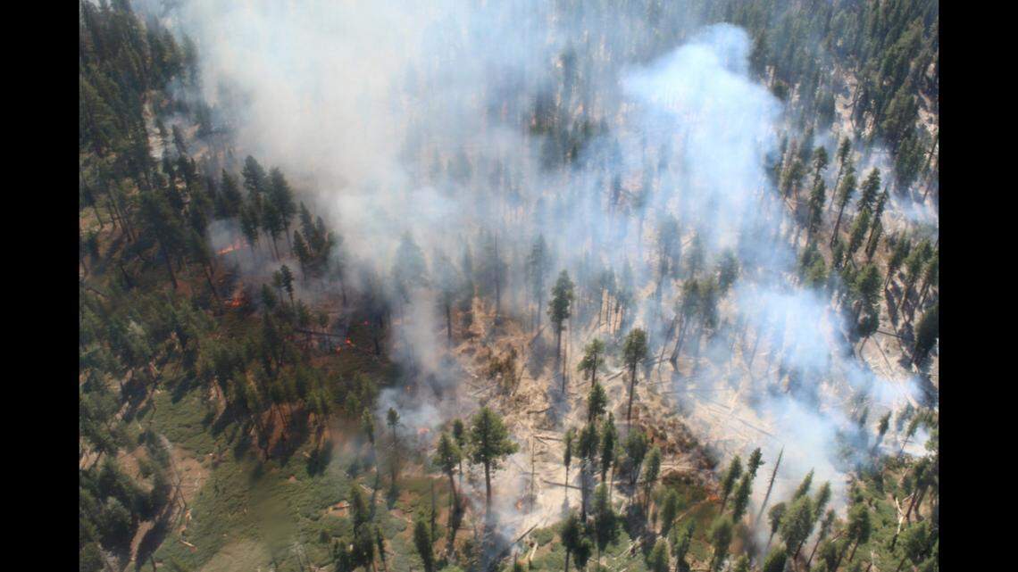 Smoke rises from the Red Fire on Tuesday, Aug. 30, 2022, in the area of Yosemite National Park.