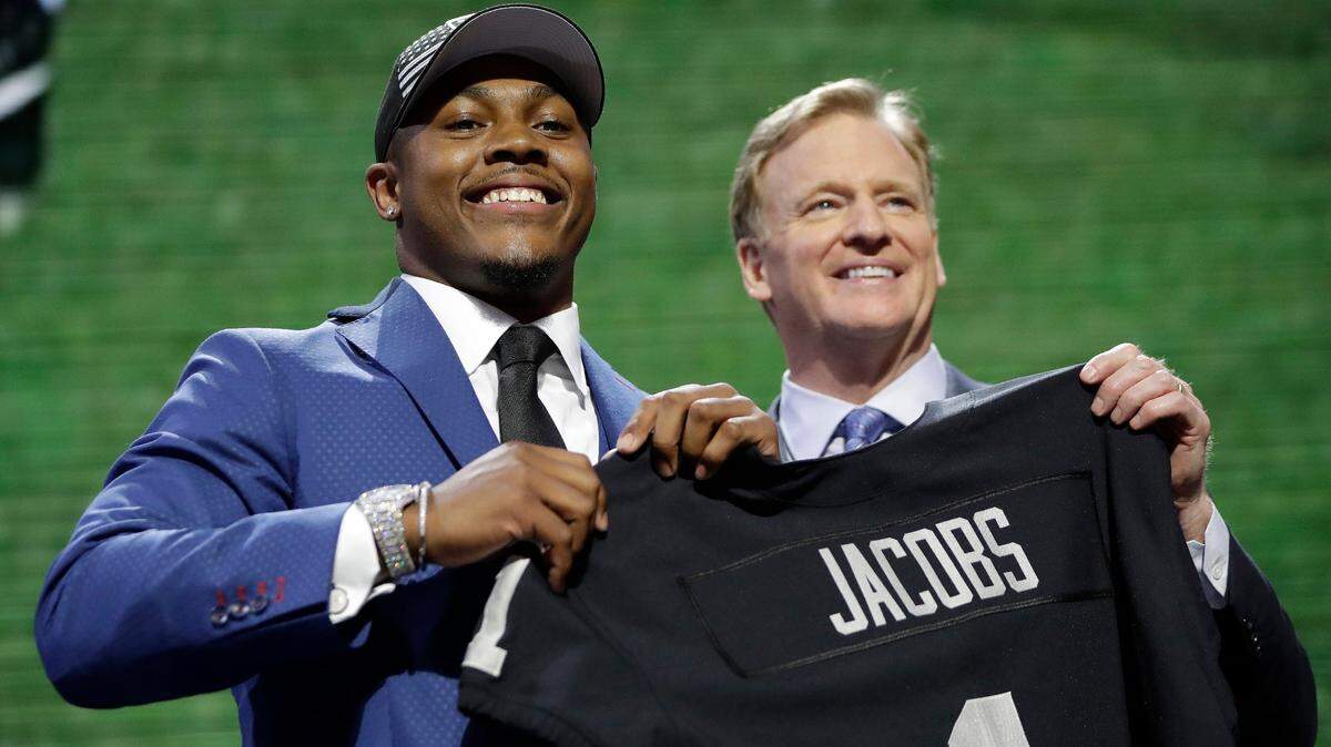 Alabama running back Josh Jacobs poses with NFL Commissioner Roger Goodell after the Oakland Raiders selected Jacobs in the first round at the NFL football draft, Thursday, April 25, 2019, in Nashville, Tenn. Jacobs went 24th overall.