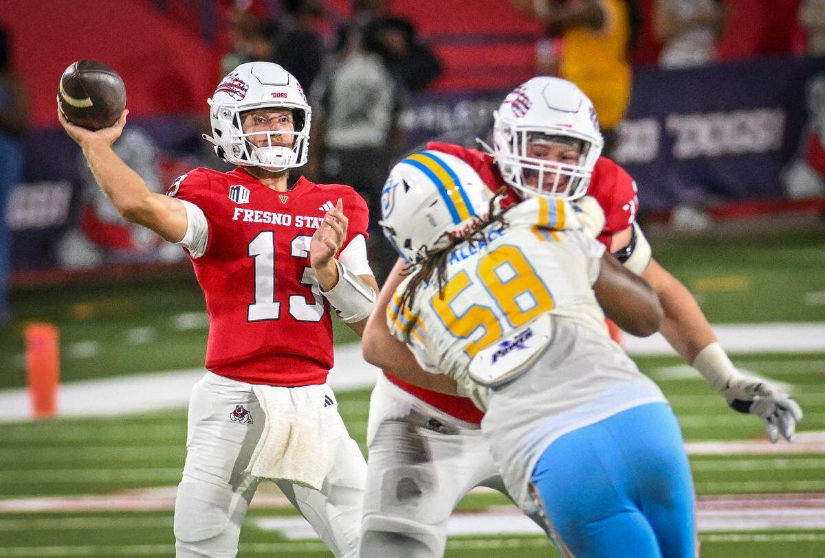 Fresno State quarterback E.J. Warner gets protection from the Southern University pass rush while throwing downfield during their game at Valley Children's Stadium in Fresno on Saturday, Sept. 13, 2025.