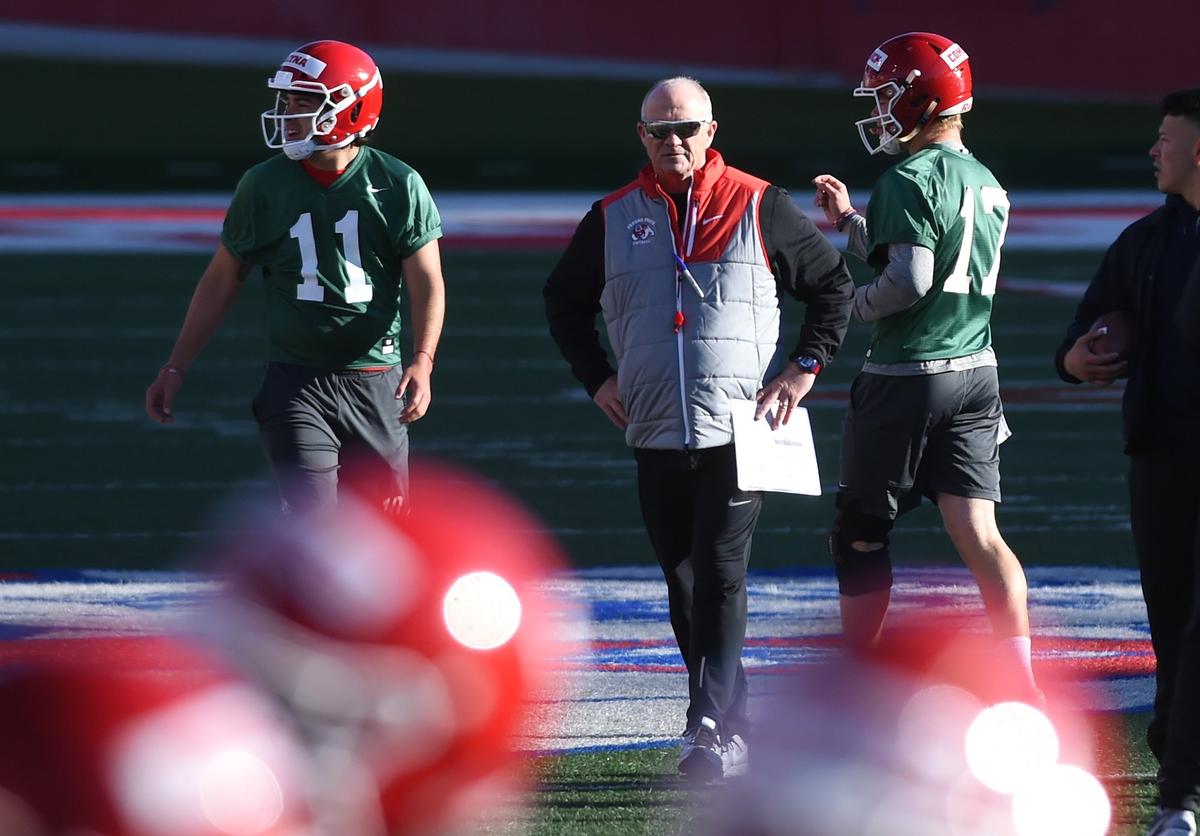 Fresno State coach Jeff Tedford watches as quarterbacks Jorge Reyna (11) and Steven Comstock (17) go through a drill on the first day of spring practice Monday morning, March 11, 2019 in Fresno.