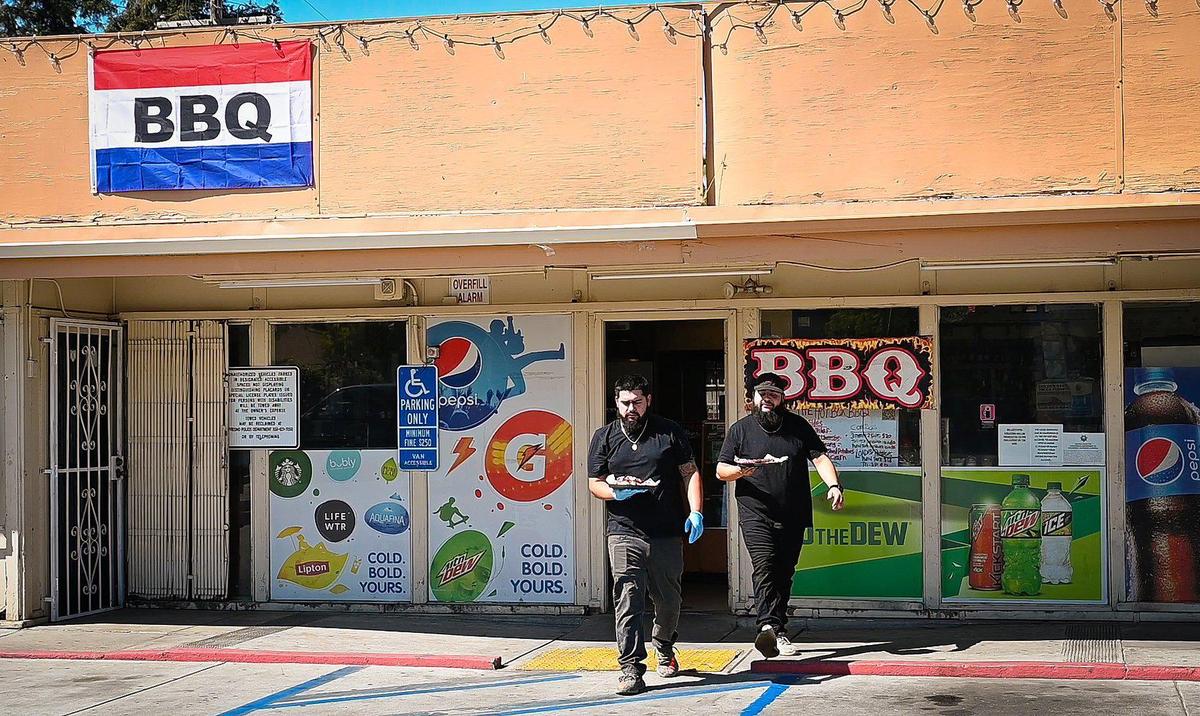 “A hole in the wall,” is how Hotbox BBQ owners Esteban Guiverra, left, and Ivan Matamoros, describe their dream of operating their own eatery, located inside a gas station. Guiverra says their potential is “to the moon.”