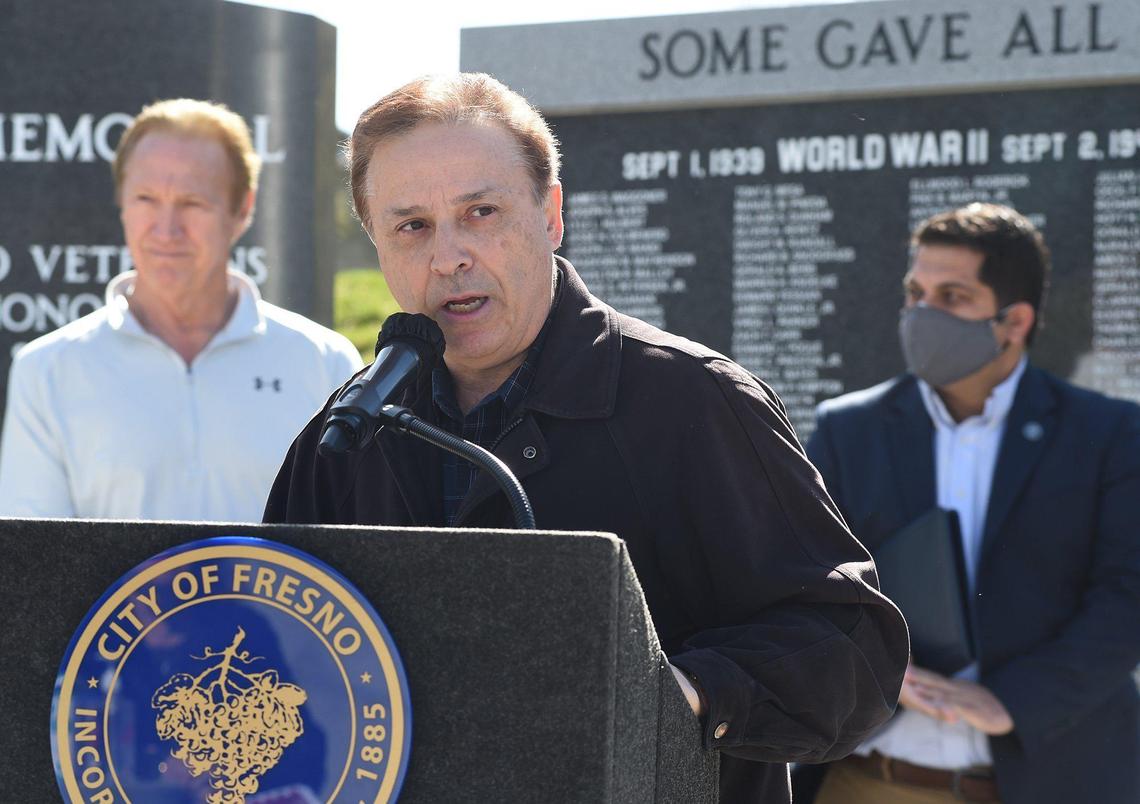 Fresno City Councilmember Garry Bredefeld, joined by former Mayor Alan Autry, left, and Councilmember Mike Karbassi, right, speaks during the Save Our Kids rally to promote reopening Fresno Unified schools during the coronavirus pandemic Saturday, March 6, 2021, at Fresno City Hall.
