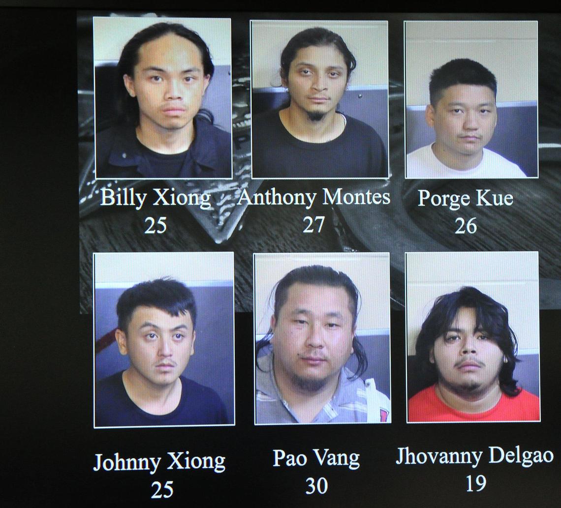Booking mugs of 6 suspects in custody in connection to the November 17 shooting deaths of 4 victims, shown at Fresno Police press conference, Dec. 31, 2019.