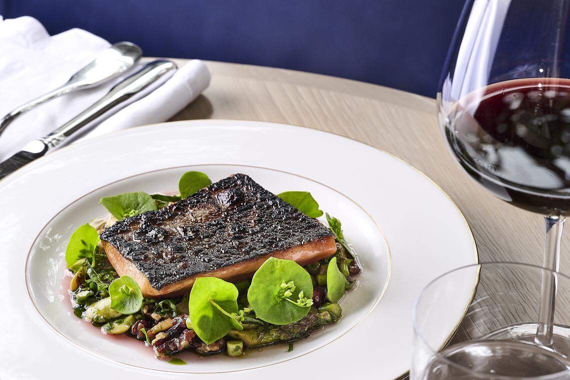Known for seafood, Chez Noir is a restaurant with a Michelin star located in Carmel, California. Its Mount Lassen trout, pictured here, is served atop a bed of Delta asparagus and toasted walnuts.