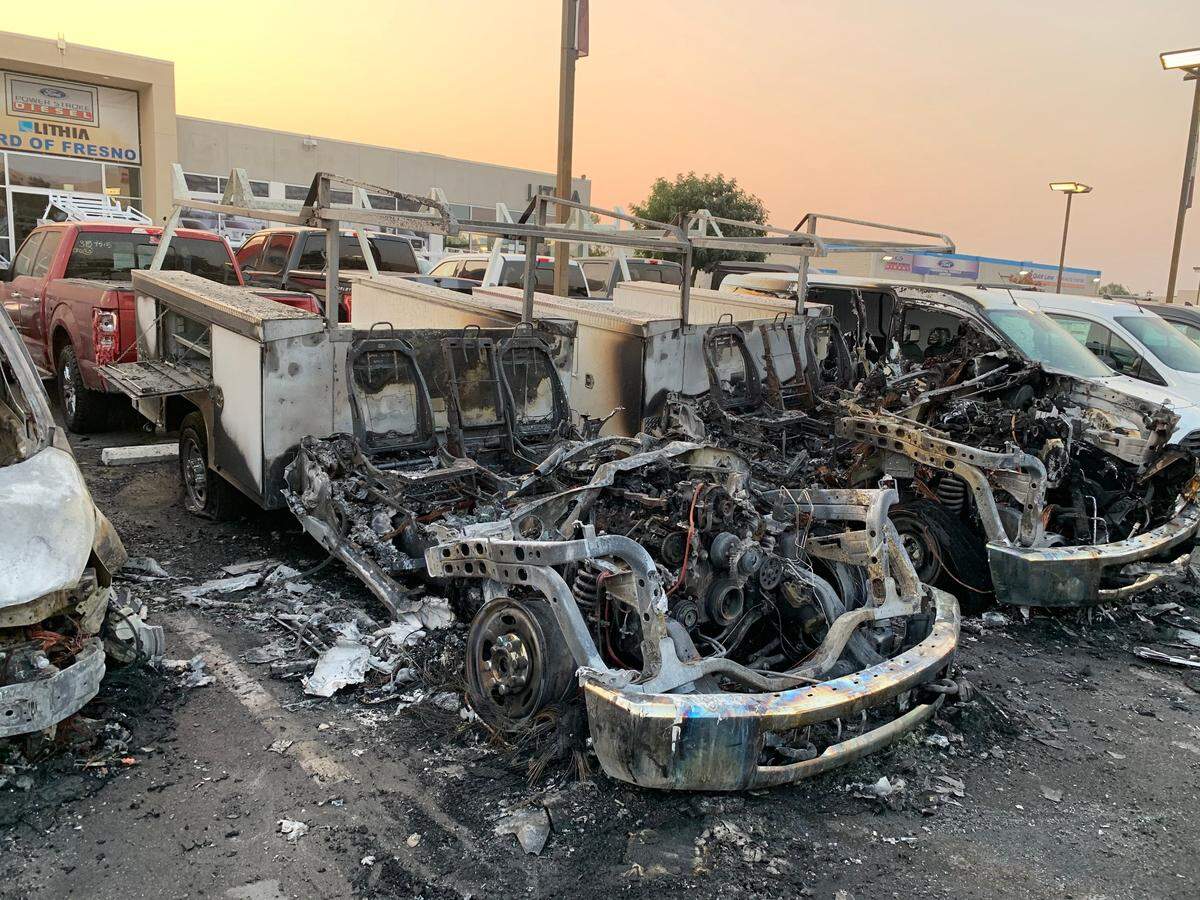 Investigators will used video surveillance to determine whether an arson destroyed multiple cars at Lithia Ford in Fresno on Friday, Sept. 4, 2020.