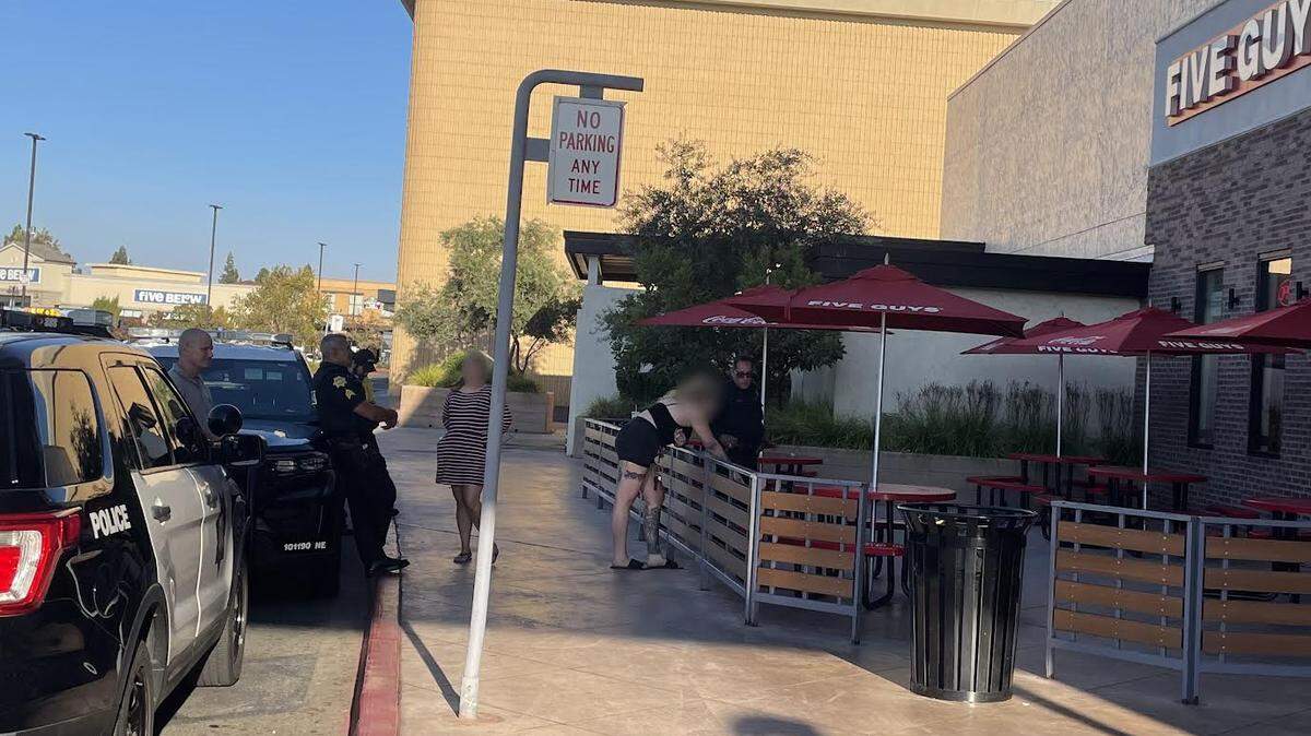 Police interview two woman who were struck by BB gun projectiles fired by a drive-by shooter Wednesday evening at the Fresno Fashion Fair mall.