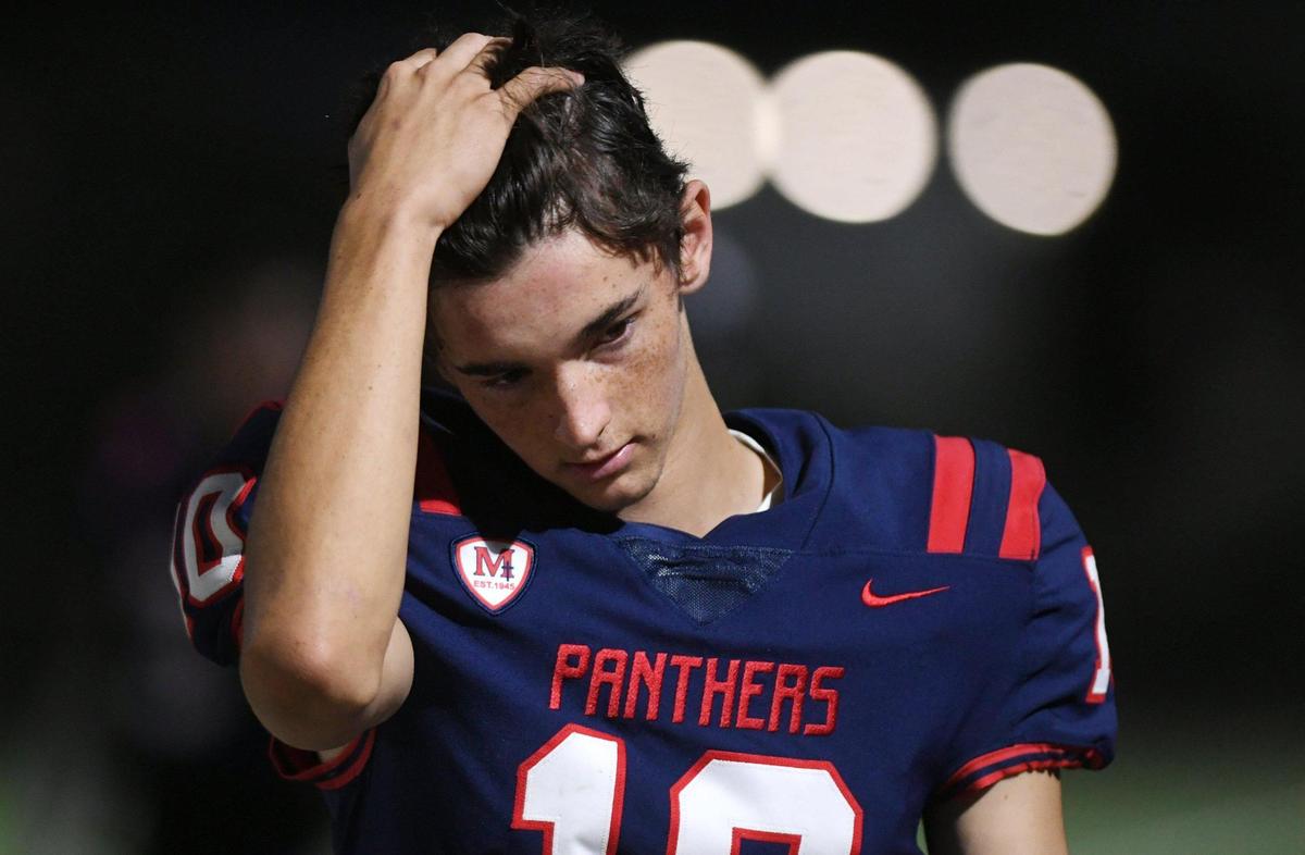 San Joaquin Memorial quarterback Carson Dean seen along the sidelines in the game against Garza High School Friday, Oct. 21, 2022 in Fresno.