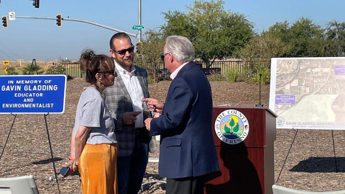Rita Gladding, mother of Gavin Gladding, speaking with Fresno County Supervisor Nathan Magsig and state Assemblyman Jim Patterson during a road dedication ceremony, Friday Sept. 8, 2023. 