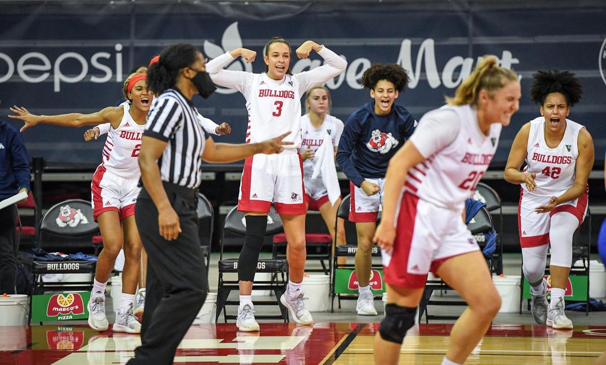Fresno State players cheer from the bench after Bree Delaney was fouled but still made the basket against Air Force during their game at the Save Mart Center on Wednesday, Feb. 10, 2021.