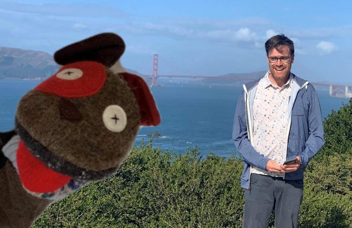 Bryan Starchman with his sock puppet, Bobby Sock, in front of the San Francisco’s Golden Gate Bridge. Starchman is writing postcards from Bobby Sock to his sister’s third and fourth-grade class in Mariposa County while traveling around the U.S. – one of several road trip projects.