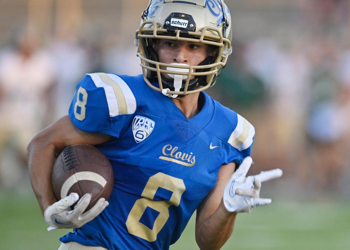 Clovis High’s Tyler Marquez runs the ball in for the second touchdown against Garces Thursday, Aug. 17, 2023 in Clovis.