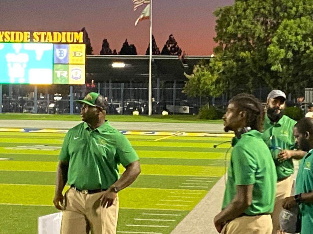 Former Fresno State star Dwayne Wright (left) made his head coaching debut at Roosevelt High on Thursday with the Rough Riders opening the 2022 season against Reedley. Wright played at Fresno State from 2003-06 and spent a season in the NFL with the Buffalo Bills.