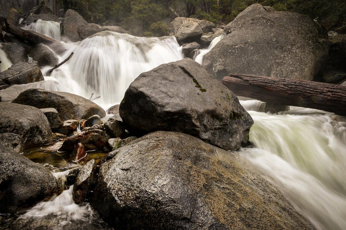 Water flows over rocks along Cascade Creek near Highway 120 on Tuesday, April 30, 2019. The Sierra Nevada snowmelt is in high gear after a bigger than normal snow year.