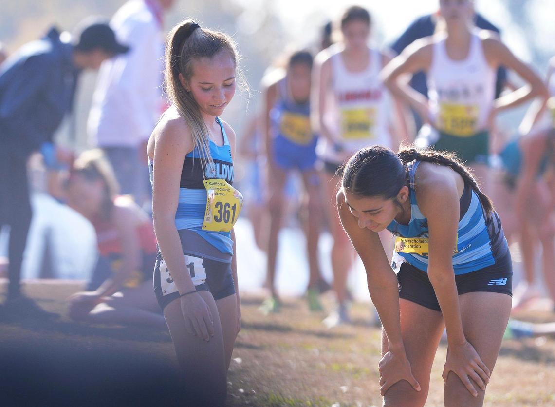 Clovis North’s Ashlyn Leath, left, who placed 15th, stands beside Gianna Bomarito, right, who placed 36th in the Division I race at the CIF state cross country championships held at Woodward Park Saturday, Nov. 27, 2021 in Fresno.