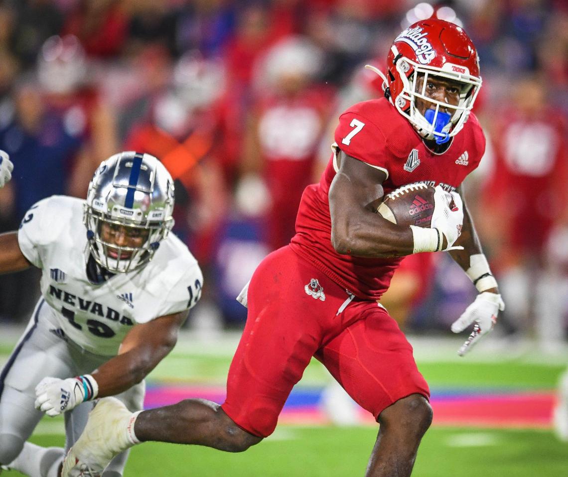 Fresno State’s Jordan Mims dashes up field on a long gain against Nevada during their game at Bulldog Stadium on Saturday, Oct. 23, 2021.