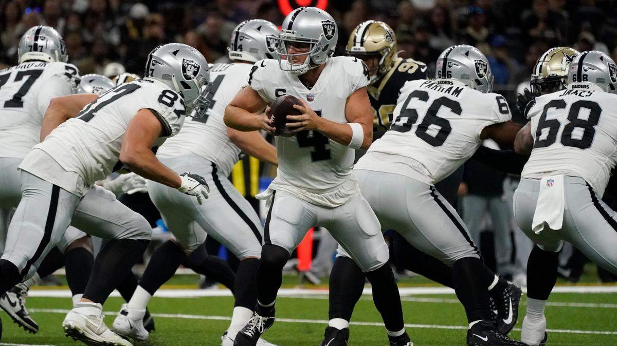 Las Vegas Raiders quarterback Derek Carr scrambles during the first half of an NFL football game against the New Orleans Saints Tuesday, Jan. 1, 2019, in New Orleans.