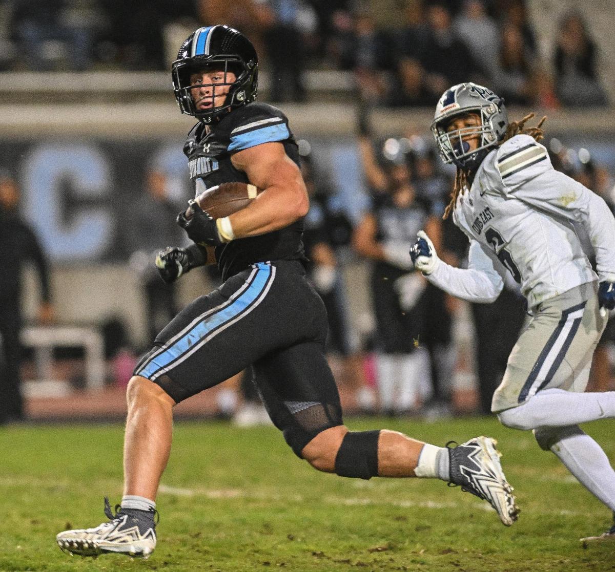 Clovis North’s McKay Madsen finds open field ahead of him on a long run for a touchdown against Clovis East in their Central Section Division I semifinal at Veterans Memorial Stadium on Friday, Nov. 17, 2023.