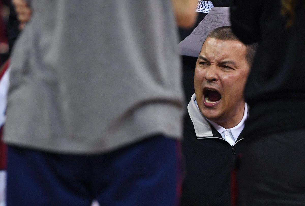 Fresno State head men’s basketball coach is seen with the team during a timeout against Boise Friday, Jan. 28, 2022 in Fresno.