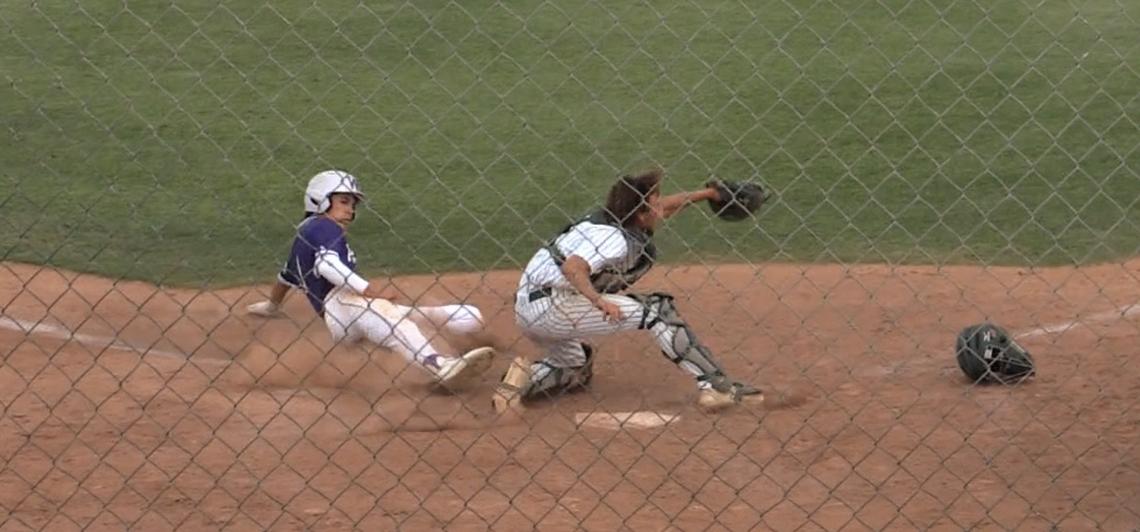 Davin Finderup of Washington Union slides home against Kingsburg in a Central Section Division II semifinal game. He was called out.