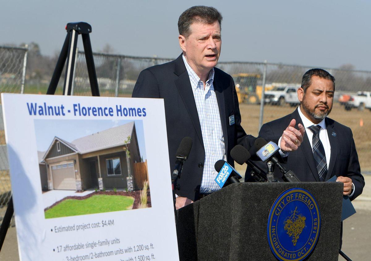 Tom Collishaw. President/CEO, Self Help Enterprises, speaks during a press conference at Annadale and Ivy avenues, with Council member Miguel Arias, right, to announce the beginning of a project to bring affordable homes to Southwest Fresno, Tuesday morning, Jan. 25, 2022.