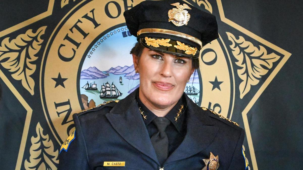 New Fresno Police Chief Mindy Casto stands near a Fresno police backdrop while taking photos with well-wishers following a swearing in ceremony held at the Saroyan Theatre in Fresno on Friday, Feb. 28, 2025.
