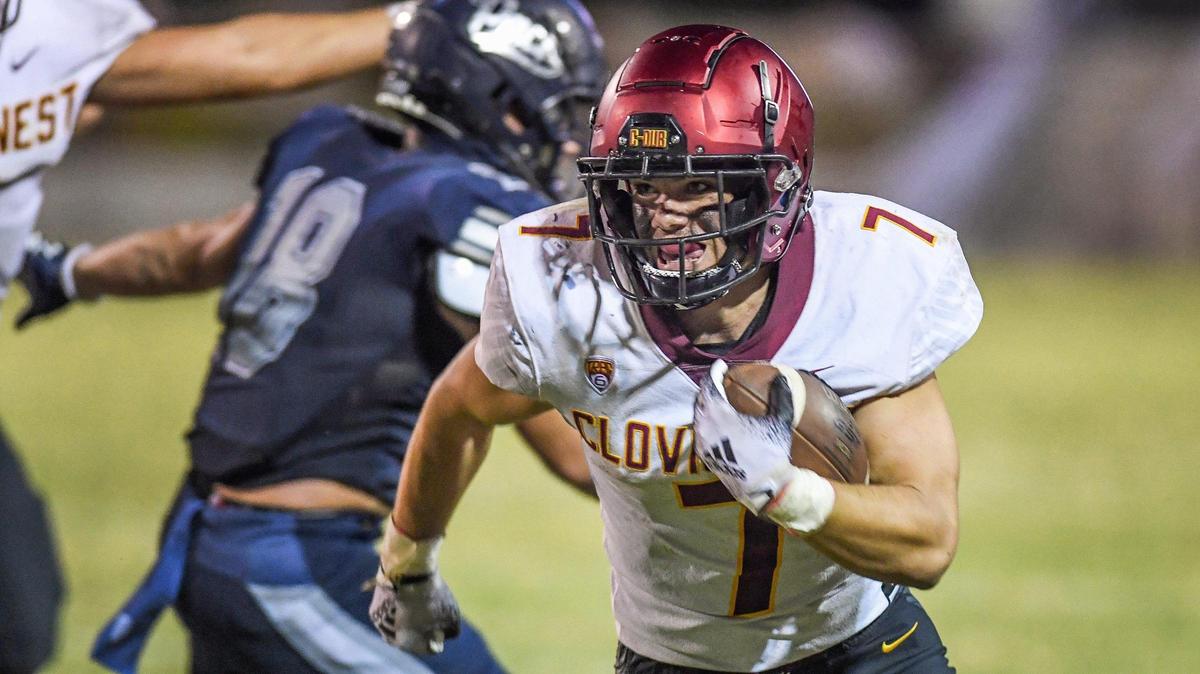 Clovis West’s Aidan Fortenberry turns the corner before charging down the sideline on a run against Clovis East during their game at Lamonica Stadium on Friday, Oct. 7, 2022.