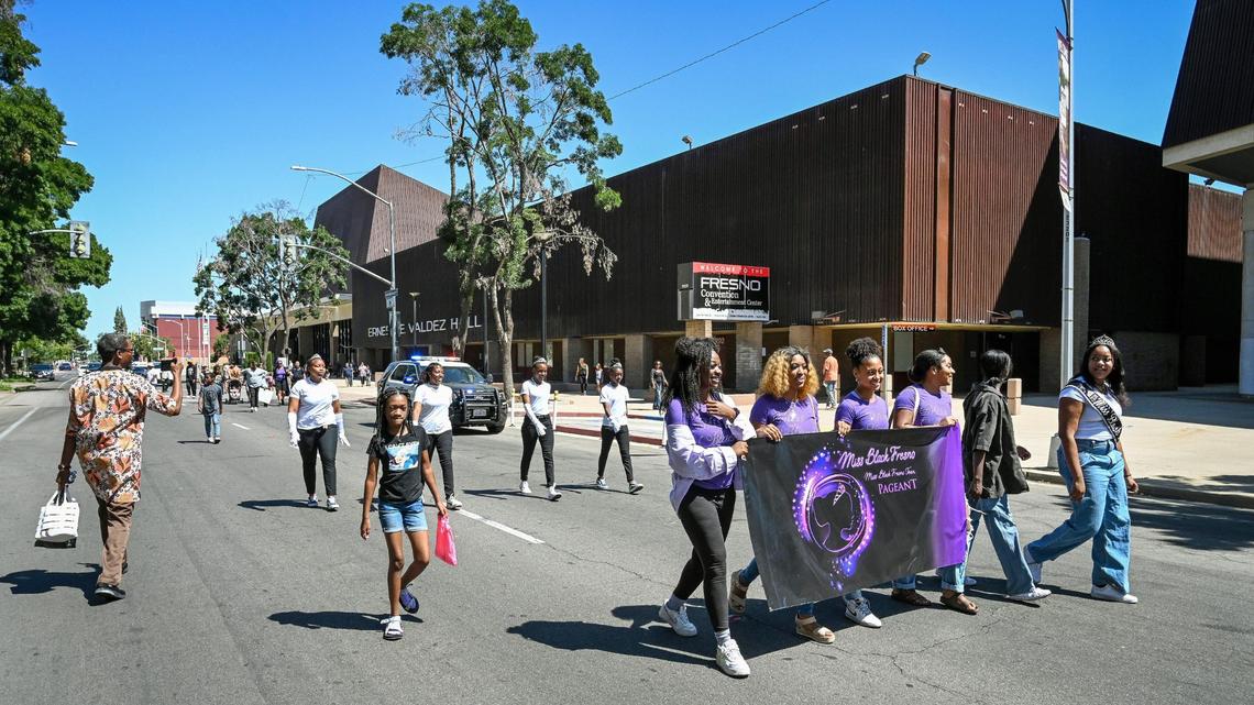 Contestants in the Miss Black Fresno pageant walk by Valdez Hall as a special Juneteenth parade concludes before continuing on with a Juneteenth Festival celebration at the Fresno Convention Center on Saturday, June 18, 2022.