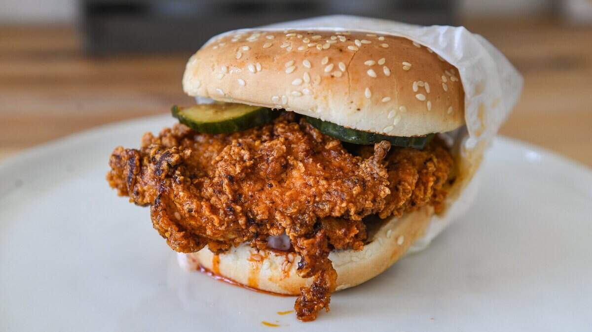 A hot chicken sandwich with homemade pickles and slaw from Pacific Fried Chicken, a locally owned restaurant recently opened in southeast Fresno.