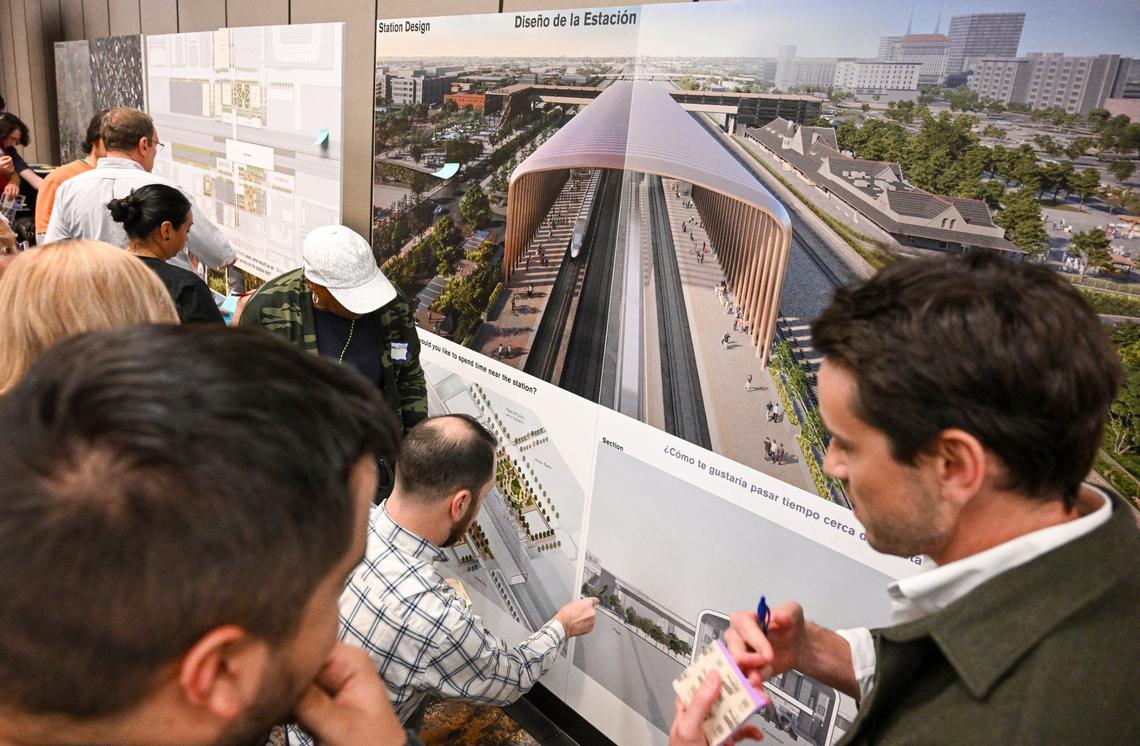 Residents and other interested parties look over plans and renderings that show what’s envisioned for the future Fresno Station of California’s High-Speed Rail project during an informational open house in downtown Fresno in 2024.