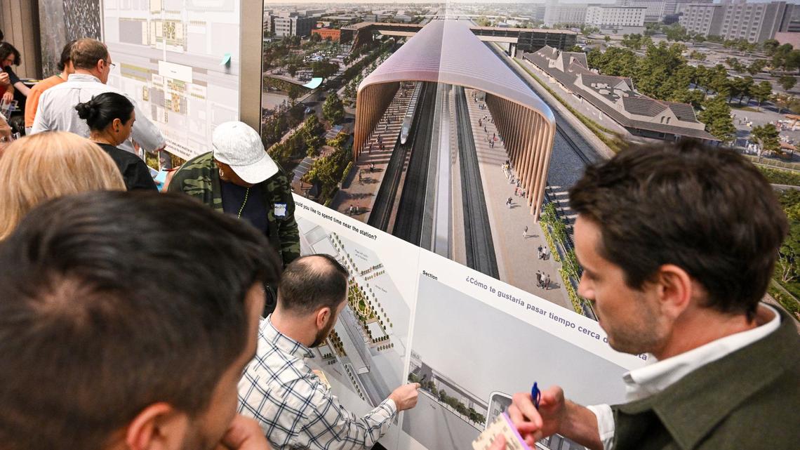 Residents and other interested parties look over plans and renderings that show what’s envisioned for the future Fresno Station of California’s High-Speed Rail project during an informational open house by the High-Speed Rail Authority at the Hilton DoubleTree in downtown Fresno on Wednesday, May 1, 2024.