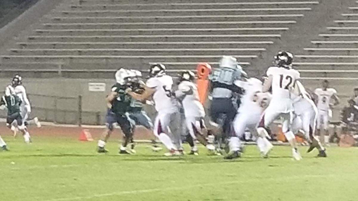 Tulare Union quarterback Nathan Lamb looks to pass Friday night in a 66-0 win over Hoover.