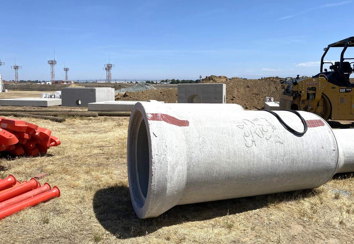 Concrete pipes and other construction material are staged near the runways at Fresno Yosemite International Airport on Friday, May 19, 2023. The airport had a groundbreaking for construction of an expansion of the aircraft ramps and terminal building.