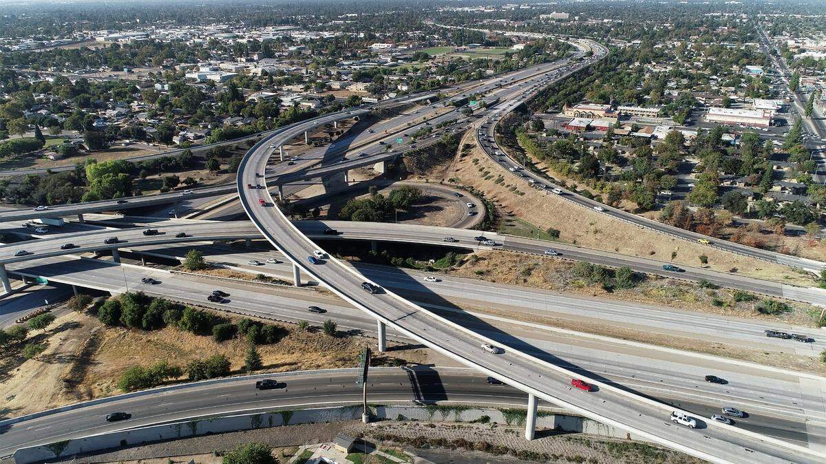 An aerial image from a drone shows the interchange of Highways 41 and 180 to accommodate traffic from a growing population in Fresno and Fresno County. Fresno County had a net increase in population of almost 2,200 residents between July 2021 and July 2022 – the 10th largest numerical increase among California’s 58 counties. Thirty-six counties saw population declines over the one-year period.