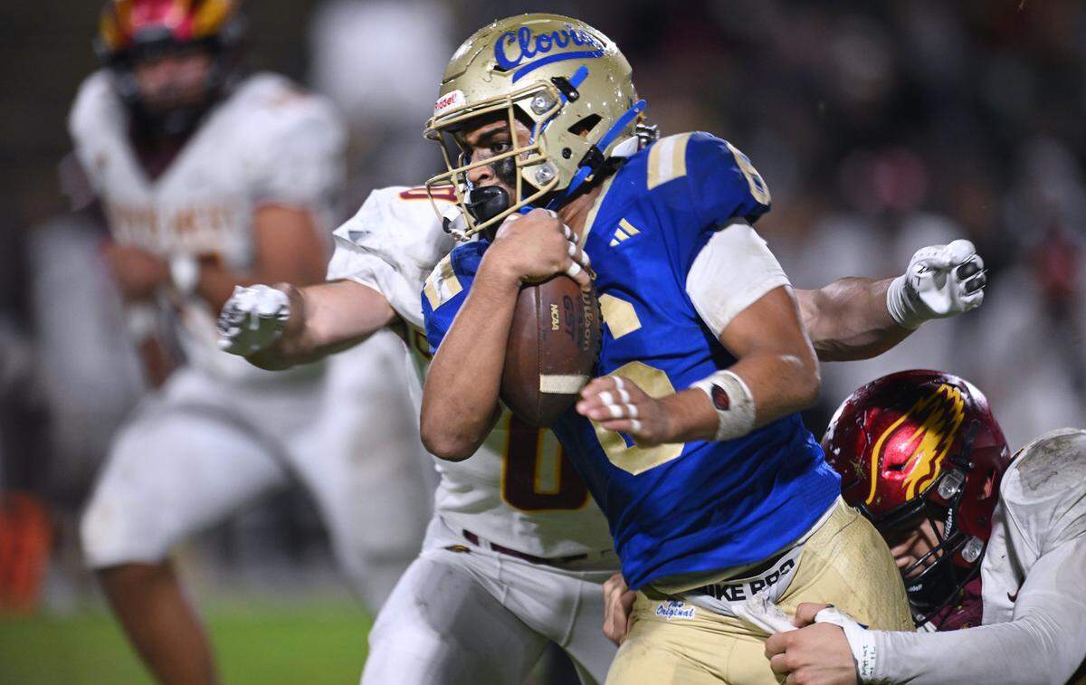 Clovis High's James Caruso carries the ball on a run against Clovis West Friday, Nov. 14, 2025 in Clovis. Clovis led 21-7 at halftime.