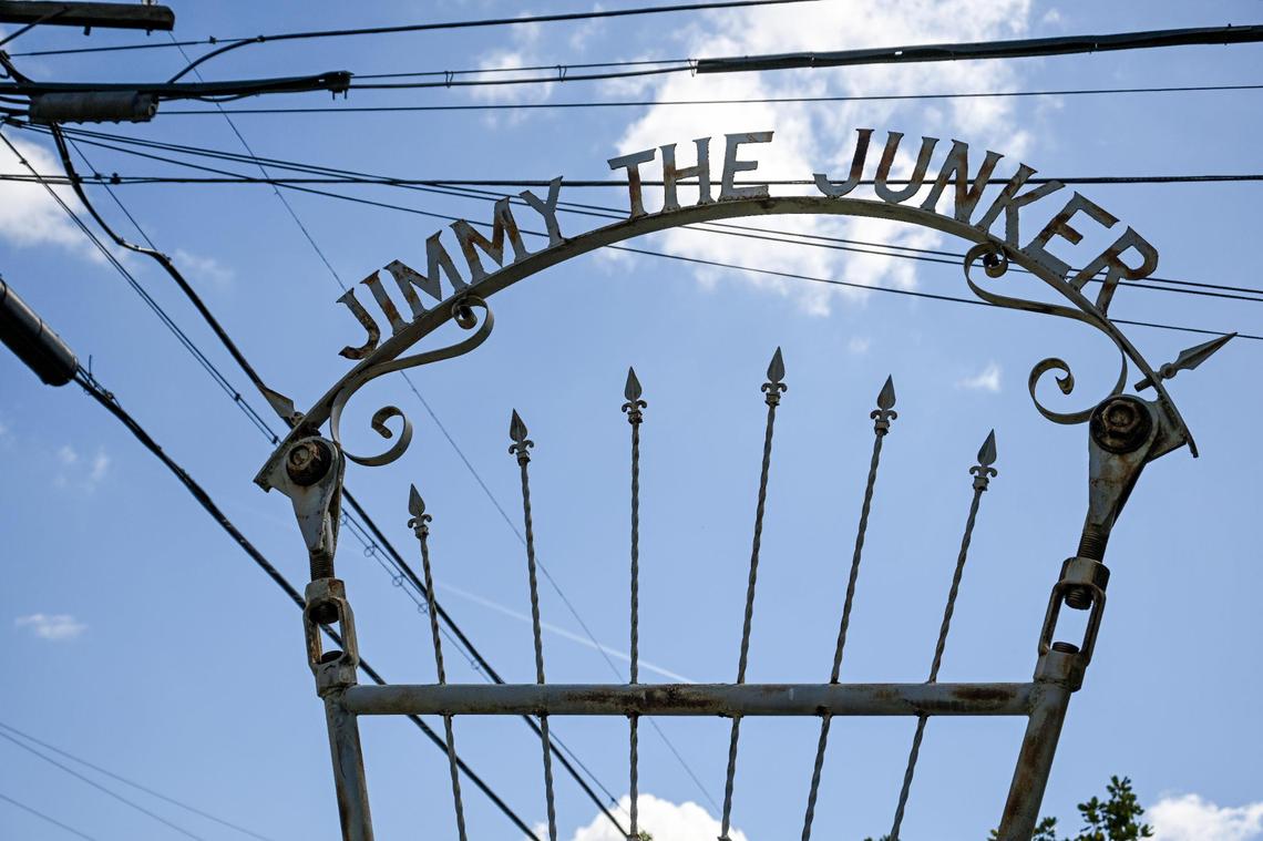 A sign declaring “Jimmy the Junker” stands above Jim Williams’ yard in the Fresno High area where he has created an eye-catching array of art over many decades.