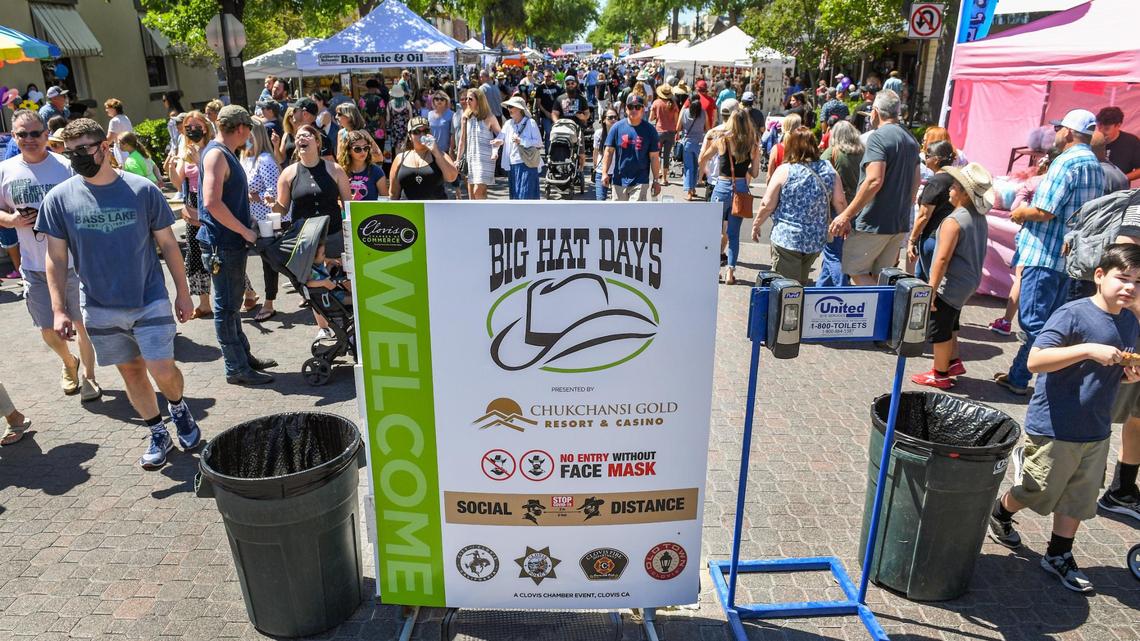 A Big Hat Days sign on Pollasky Avenue in Old Town Clovis states no entry without a face mask, although most were not wearing them as the celebration returned Saturday, June 12, 2021. This year’s event was pushed back from April and last year’s canceled due to the coronavirus pandemic.