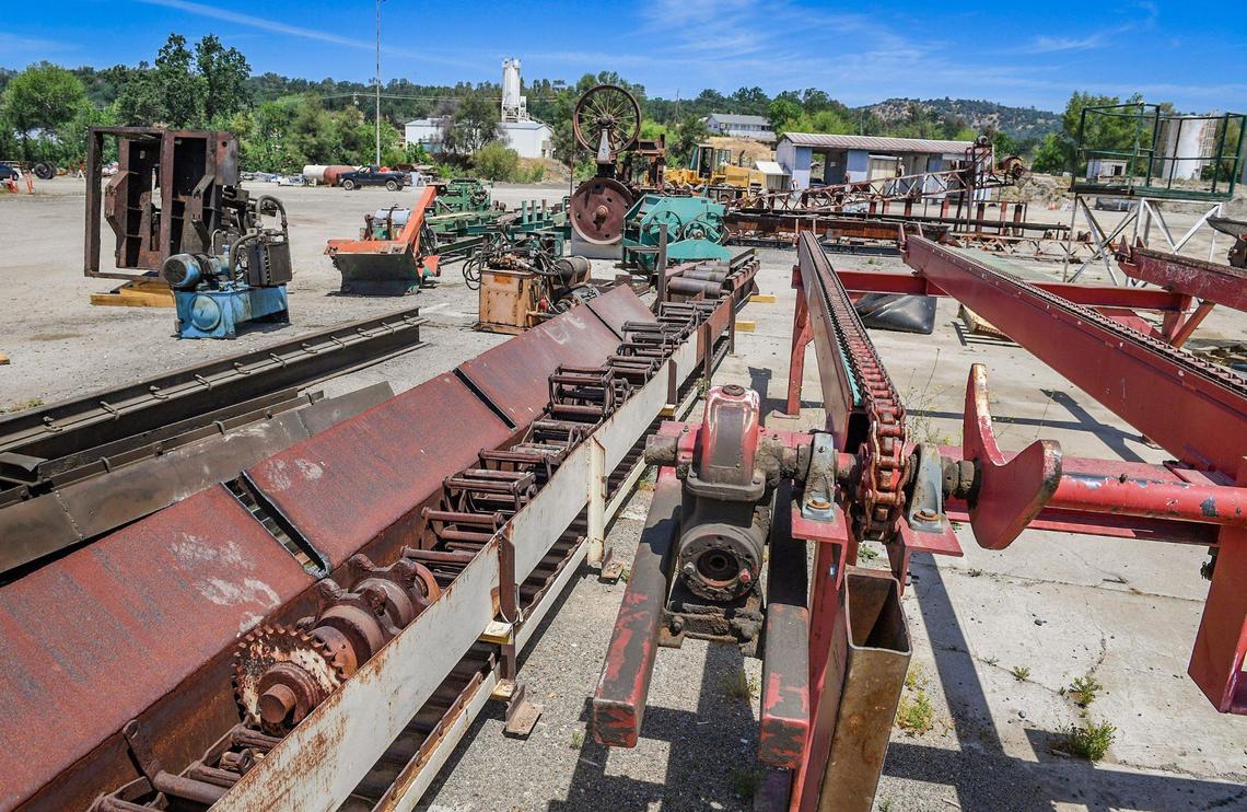 Various sawmill equipment recently purchased by Kirk Ringgold for his anticipated sawmill operation sits on his land in Auberry, on Thursday, May 13, 2021.