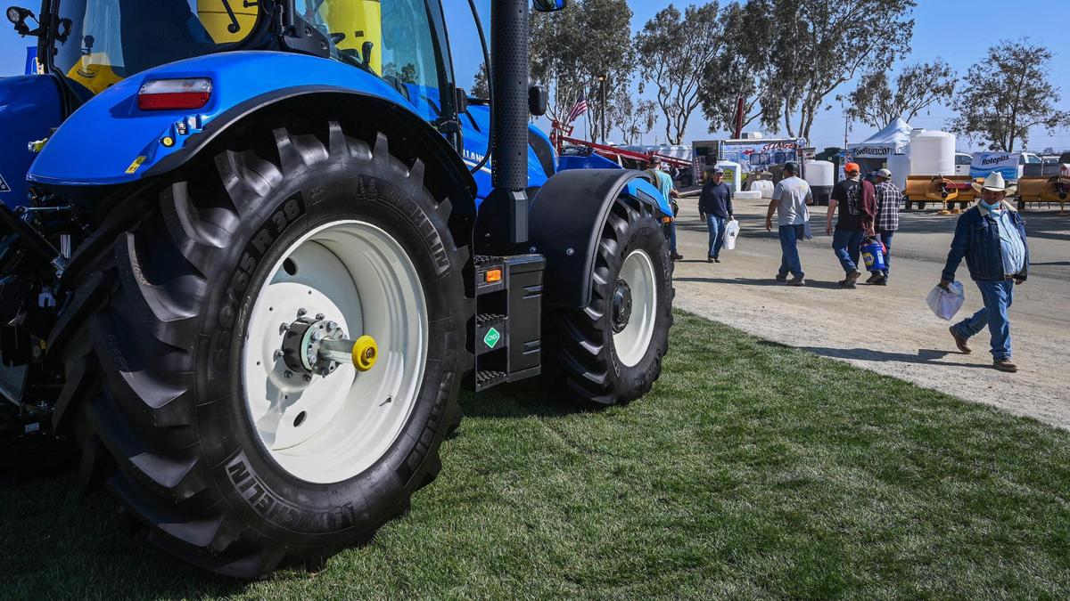 Farm show-goers can once again kick the tires on tractors in person at the World Ag Expo in Tulare on Tuesday, Feb. 8, 2022.