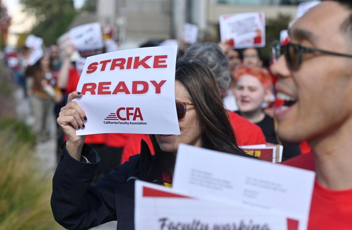 Hundreds marched through the Fresno State campus as the Fresno Chapter of the California Faculty Association held a rally calling attention and support for contract negotiations Tuesday morning, Nov. 7, 2023 in Fresno.