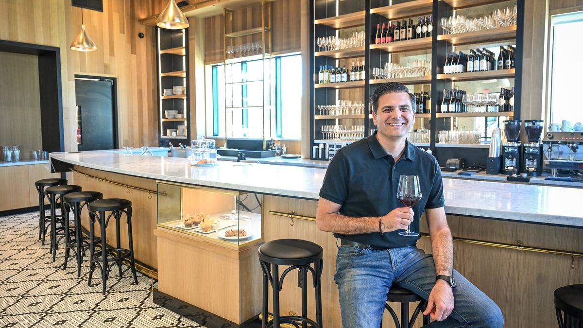 Vincent Ricchiuti, one of the family owners of Il Caffè, a cafe within Enzo's Table in northwest Clovis, sits in the cafe's extensive bar area with a glass of their featured Italian wines. The cafe, located in The Avenue complex at Willow and Shepherd, serves traditional Italian espresso drinks, coffee, baked goods as well as wine. 