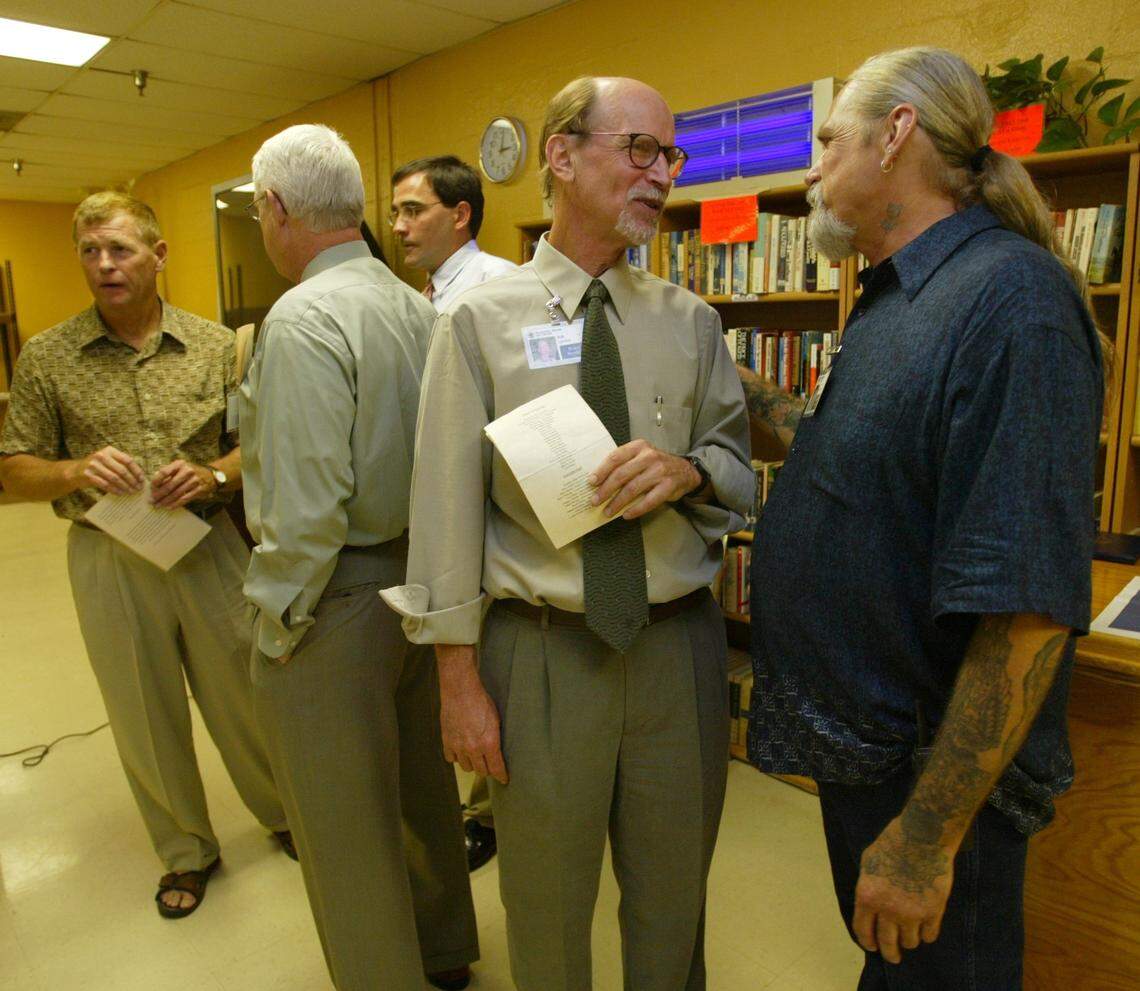 Robert Levine, center, then-board president of the Poverello House, at a 30th anniversary celebration for the Fresno homeless shelter in 2003.