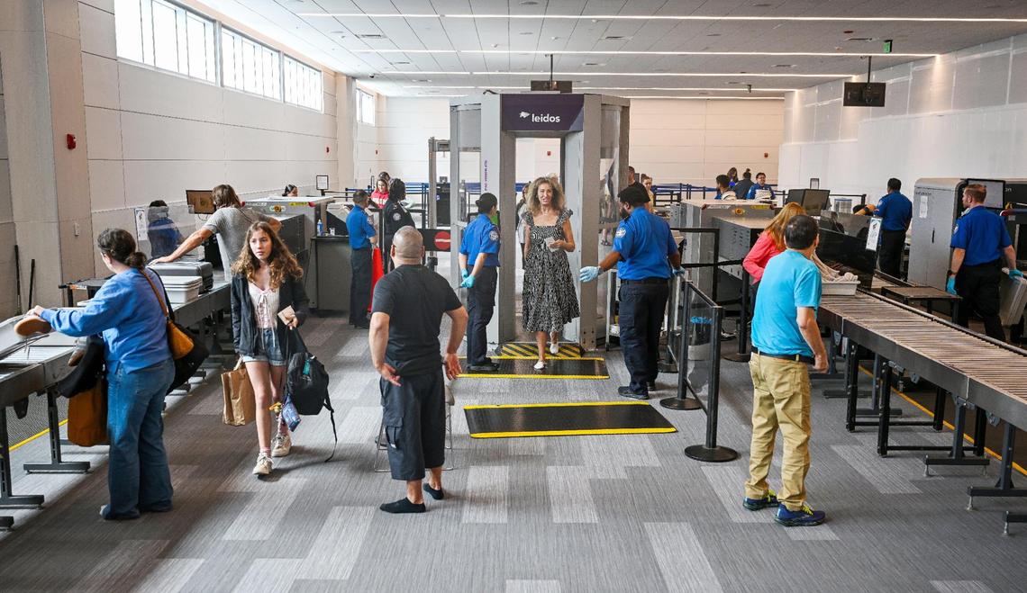 Travelers make their way through an expanded security checkpoint, which was officially unveiled to the public during a ceremony at Fresno Yosemite International Airport on Wednesday, April 23, 2025.