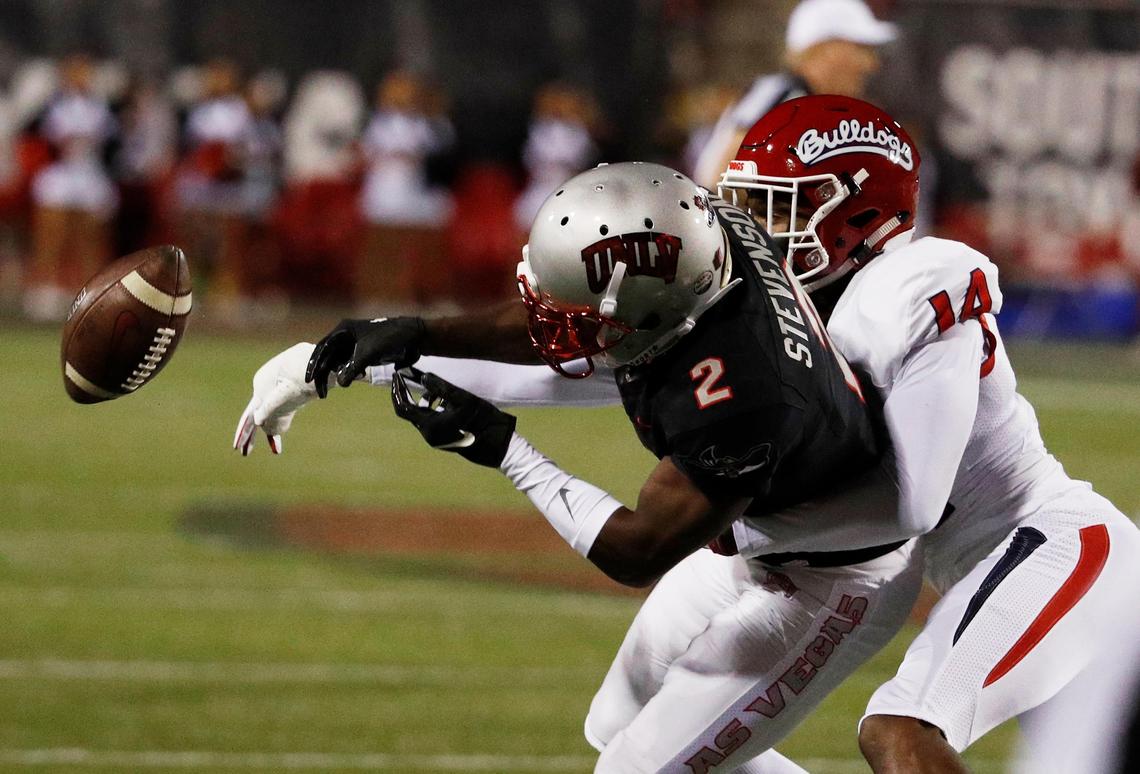 Fresno State cornerback Jaron Bryant breaks up a pass intended for UNLV Rebels’ wide receiver Mekhi Stevenson (2) in the Bulldogs’ 48-3 victory.  The Bulldogs had a streak of eight consecutive games with at least one interception snapped in a victory over San Diego State Saturday, Nov. 17, 2018.