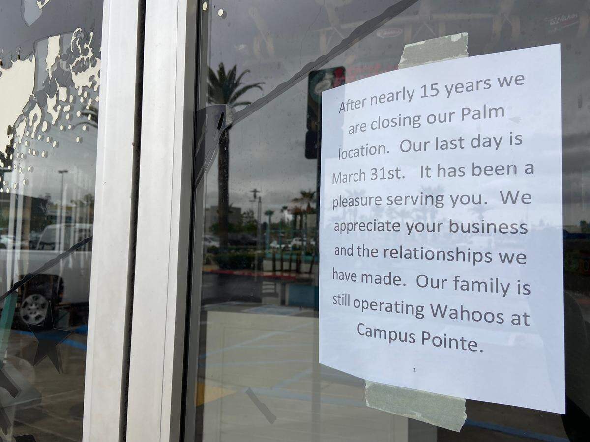 A note on the door of the northwest Wahoo’s Fish Tacos announces its closing. The Campus Pointe location will remain open.